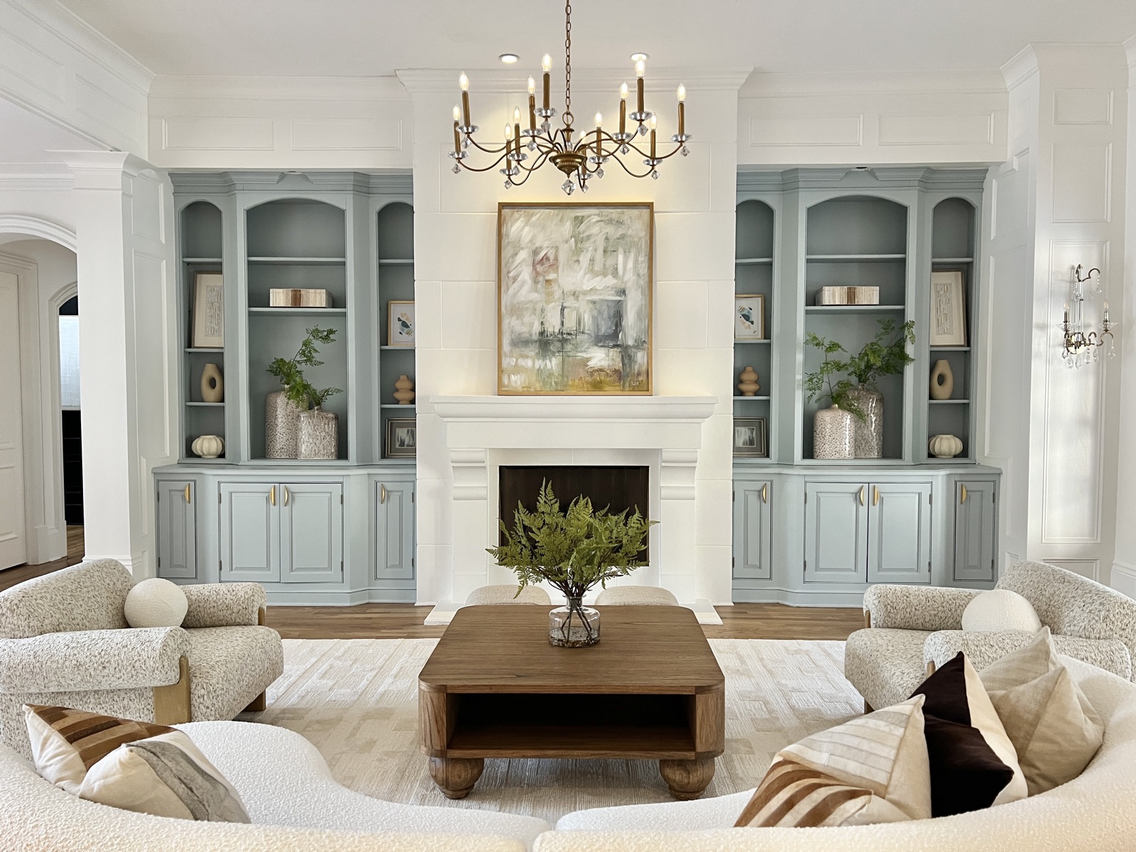 Luxury living room with custom built-ins and a fireplace, staged by Design2Sell in Metro Atlanta