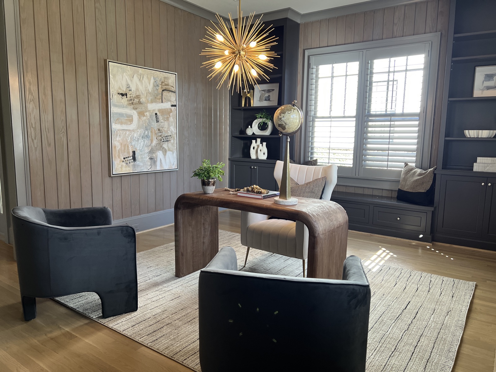Designer sitting room with sculptural accent chairs in an Atlanta luxury home
