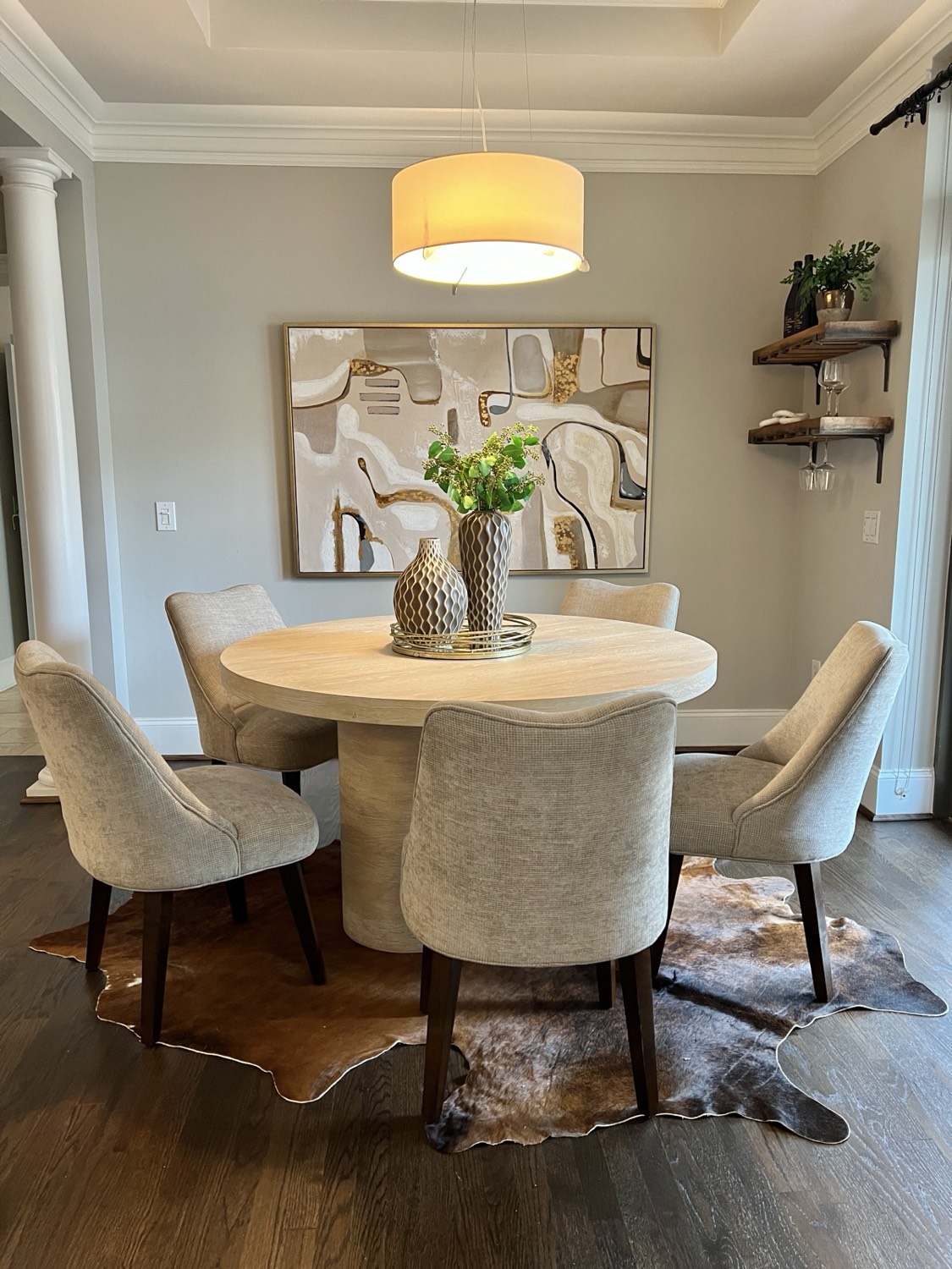 Staged dining area with layered art and textures in a Metro Atlanta home